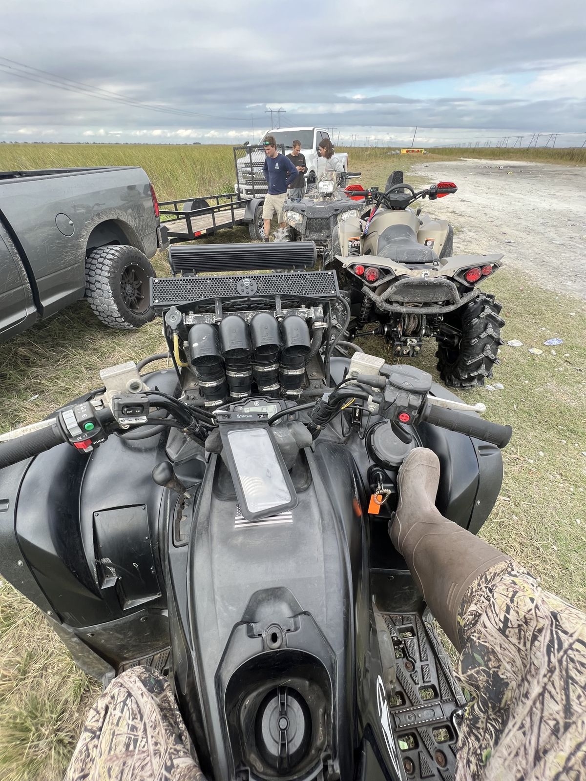 Lineup of ATVs at a staging area
