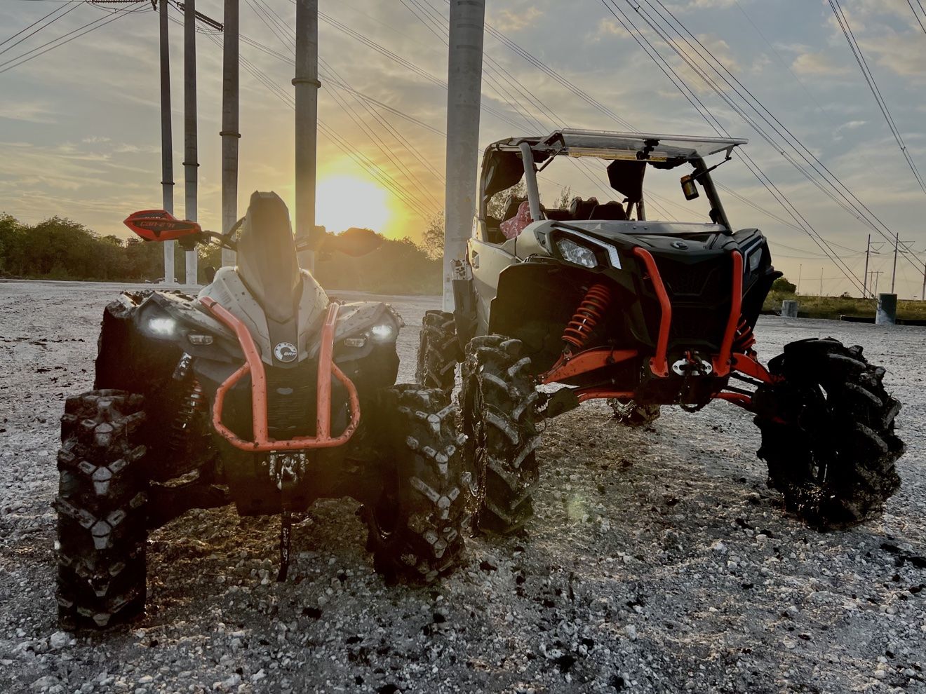 Two SXSs at sunset at a staging area