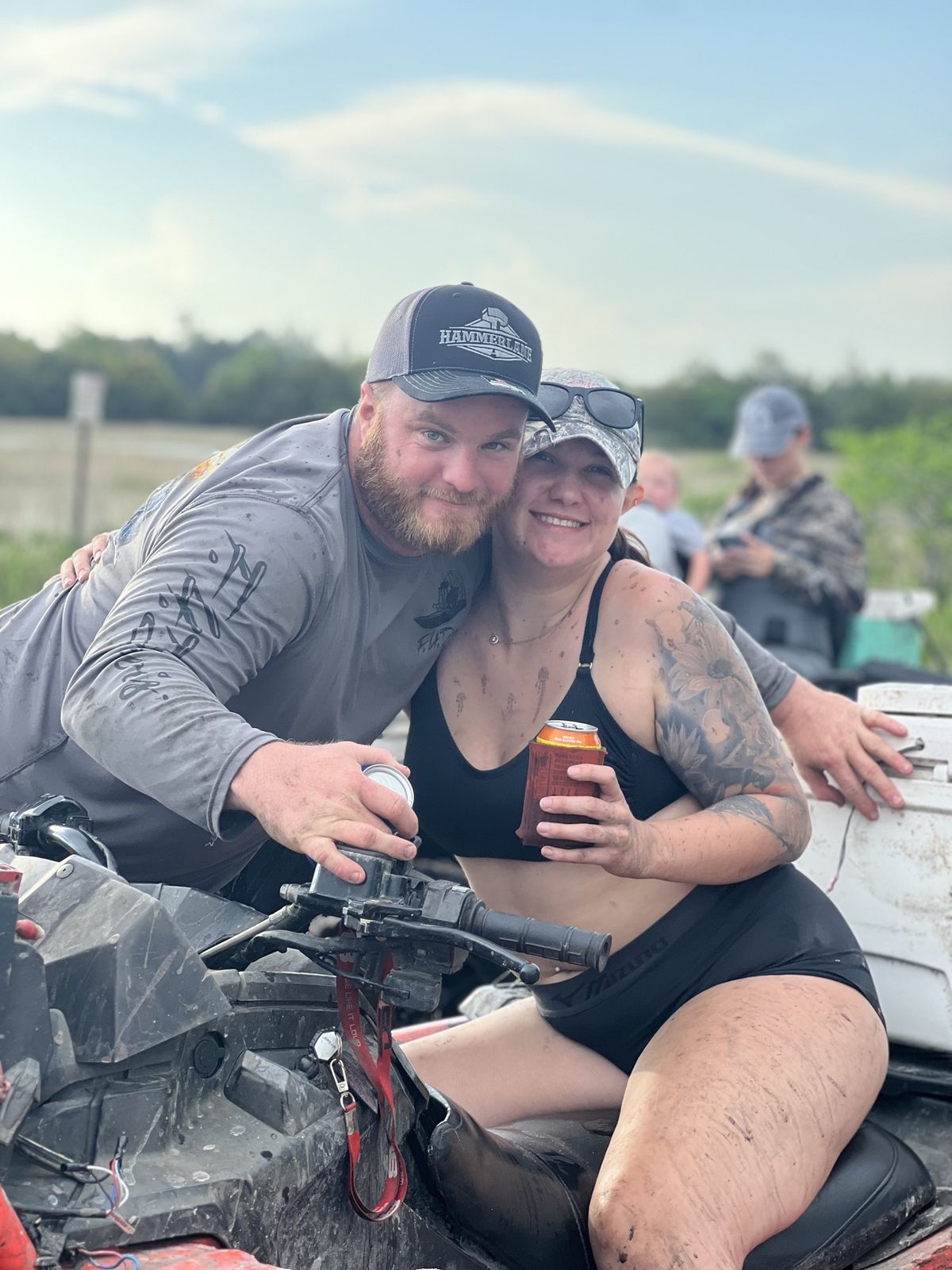 Couple posing on an ATV